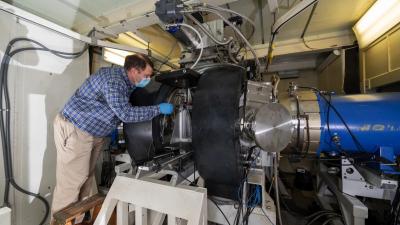 Matthew Wolford inspects the Electra argon- fluoride (ArF) laser