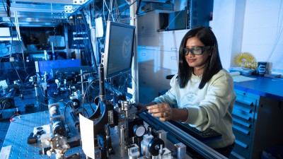 A scientist works in University Distinguished Professor Carmen Menoni’s Advanced Thin Films Deposition Laser Lab in May at CSU. 