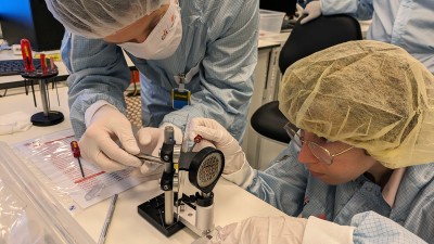 Elizabeth Grace (LLNL, right) and Filip Grepl (ELI Beamlines, left) assemble the PROBIES diagnostic