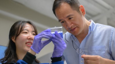 Professor Ju Li (right) and postdoc So Yeon Kim (left) examine samples of the composite they have fabricated for their demonstrations.