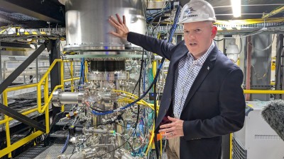 Matthew Thompson, Zap vice president of systems engineering, alongside a demo fusion reactors at the company’s Everett, Wash., research and development facility.